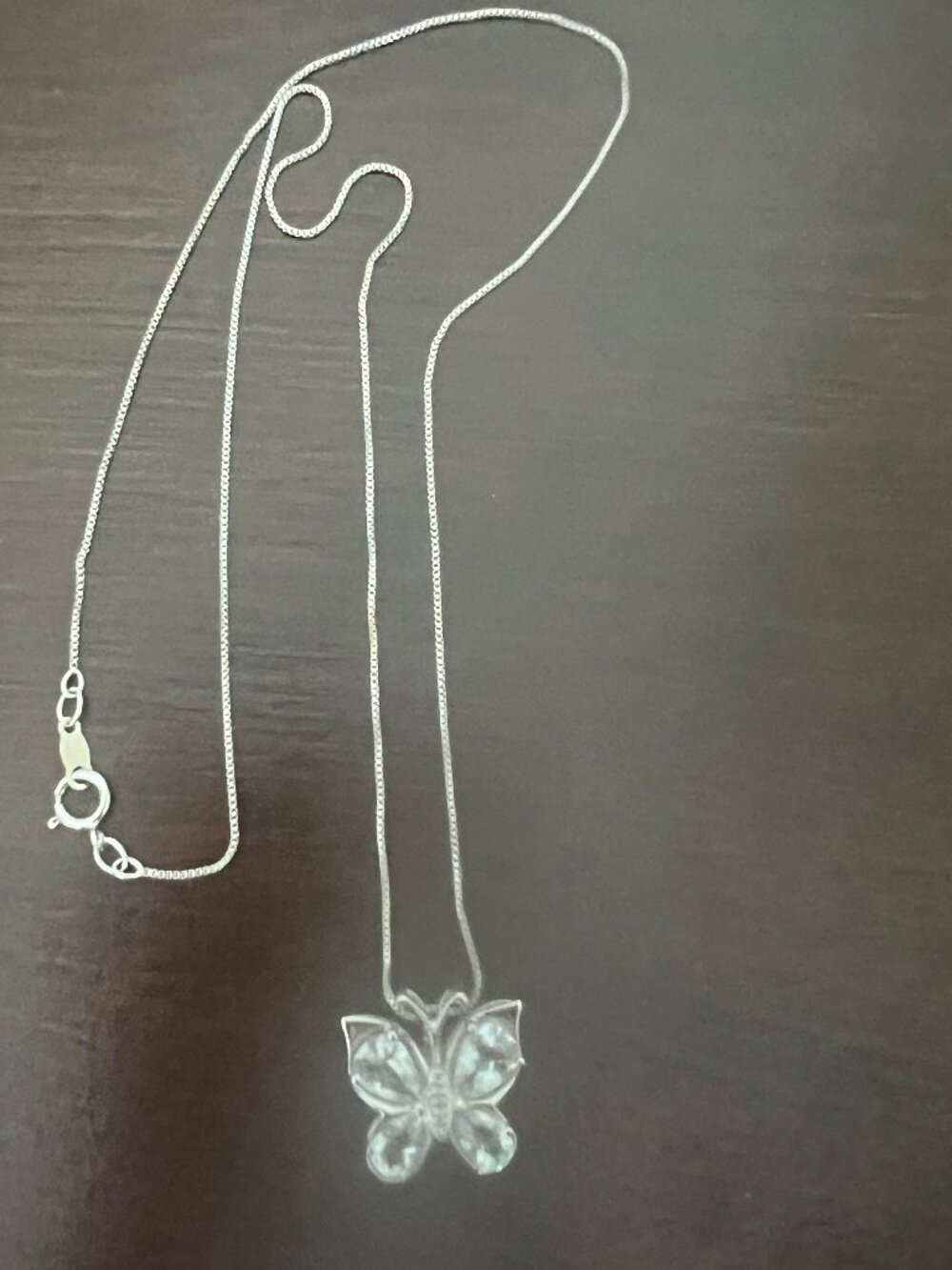 Silver necklace with charming genuine aquamarine butterfly pendant.